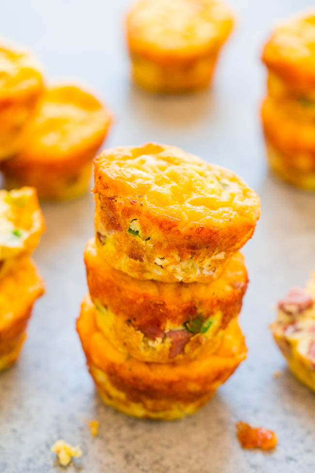 100-Calorie Cheesy Sausage Baked Egg Muffins - Low carb baked egg muffins that are loaded with juicy sausage and cheese! EASY, ready in 30 minutes, and perfect for breakfast, brunches, snacks, or breakfast-for-dinner! You'll want to keep a stash on hand!!