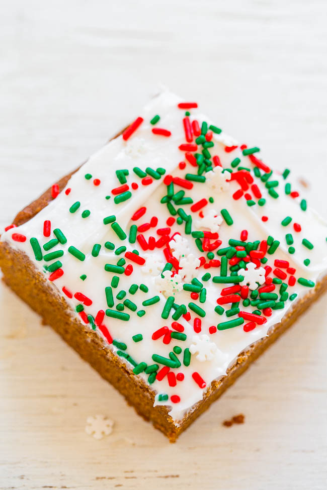 gingerbread bar topped with cream cheese frosting and holiday sprinkles