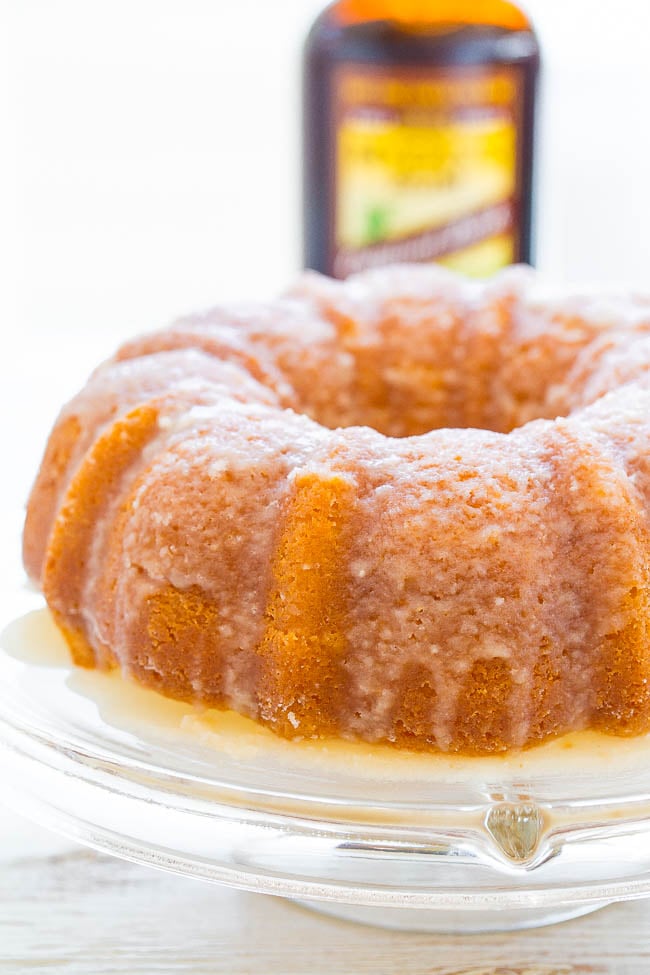 side view of a rum cake on a cake stand 
