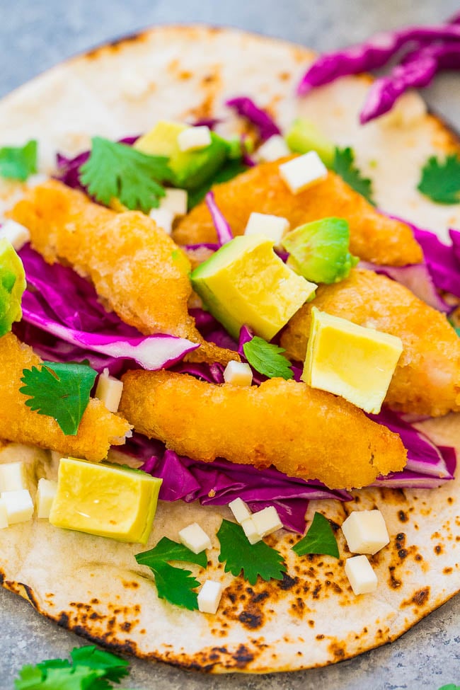 Beer Battered Shrimp Tacos with Lime Crema - Fast, EASY, restaurant-quality tacos at home!! Juicy beer-battered shrimp, avocado, cheese, and a zesty lime crema to top it off! Perfect for weeknight dinners and easy entertaining!!
