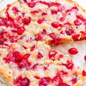 A freshly baked cranberry cake in a glass dish.