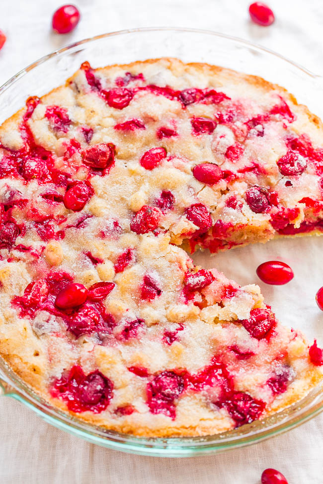 Crustless Cranberry Pie - FAST, super EASY, no-mixer dessert that's perfect for holiday entertaining!! Somewhere in between pie, cake, and blondies is what you get with this FESTIVE recipe! Take advantage of those fresh cranberries!!