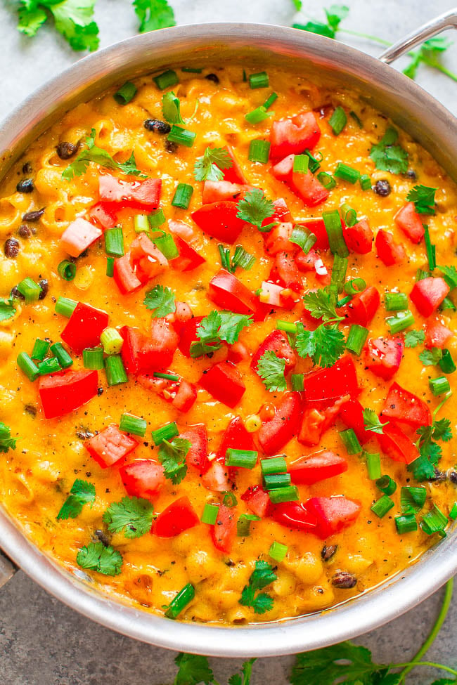 Easy 30-Minute Taco Mac and Cheese — Super creamy, ultra cheesy, flavored with taco seasoning, black beans, green onions, tomatoes, and cilantro!! EASY comfort food with a Mexican flair that's a family FAVORITE!!