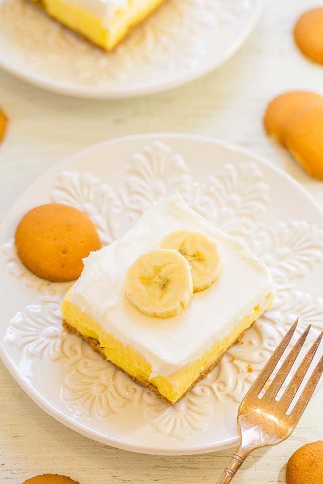 Banana Pudding Bars — Faster and easier than making a banana cream pie and taste AMAZING!! A crunchy crust, tender banana slices, luscious banana pudding, and creamy whipped topping make these layered pie bars WINNERS!!