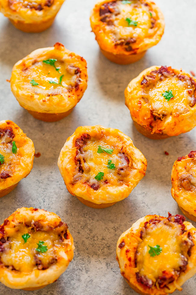 Chili Cheese Cups - Beef chili, topped with loads of cheese, and baked inside flaky, tender biscuits!! Perfect for game day parties and entertaining or an EASY weeknight dinner that's ready in 30 minutes!!