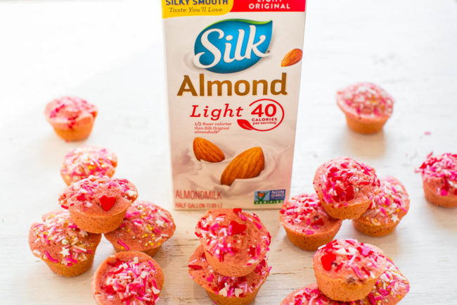 Pink Mini Muffins - Fast, EASY, no-mixer muffins that are accidentally VEGAN!! No butter, dairy, or eggs, and you won't miss them! Pink mini muffins with sprinkles on top will make everyone SMILE this Valentine's Day!!