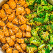 A pot of stir-fried diced chicken and broccoli in a sesame sauce.
