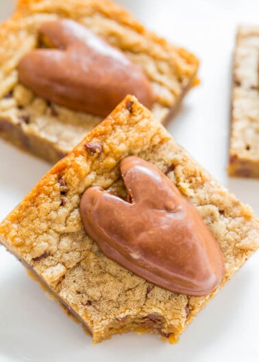 Blondie bars with chocolate hearts on top.