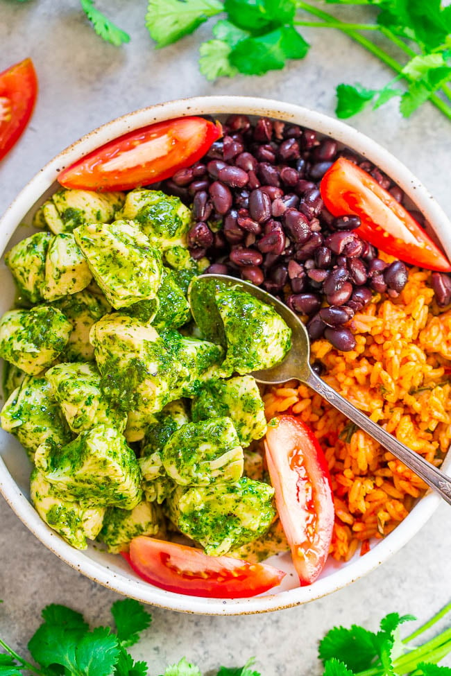 20-Minute Cilantro Chicken with Rice and Beans - EASY, healthy, and the fresh cilantro sauce is SO good!! The chicken is juicy, loaded with flavor, and along with the rice and beans and you'll be SATISFIED for hours!! 