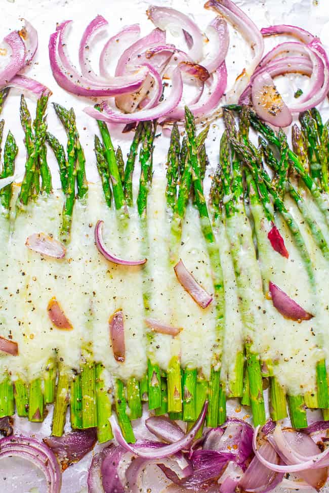 Roasted Cheesy Asparagus — Even picky eaters will LOVE asparagus when it's roasted with onions and covered with melted CHEESE!! A fast and EASY side that's perfect for busy weeknights!!