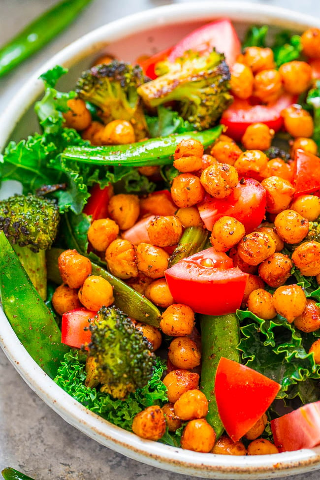 close up view of a roasted chickpea salad in a white dish 