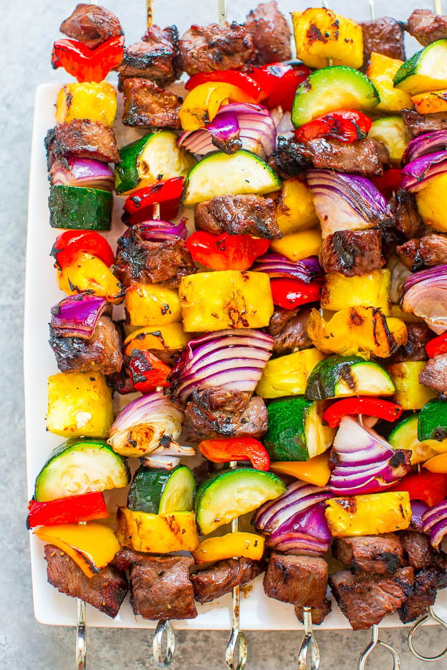 close up of Grilled Steak Kabobs on white serving platter