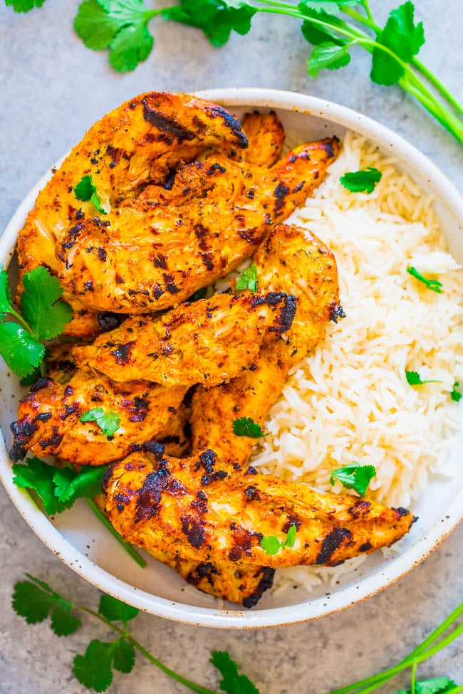 Grilled Tandoori Chicken with rice in white bowl