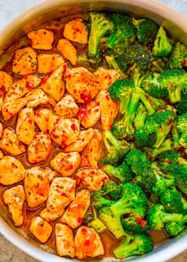 A bowl of chicken and broccoli stir-fry seasoned with spices.