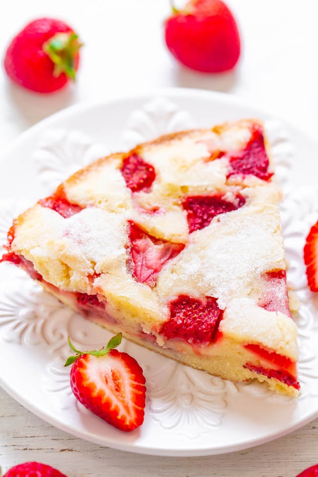 slice of Crustless Fresh Strawberry Pie on white plate with fresh berries