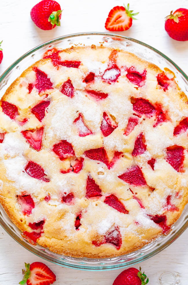 Crustless Fresh Strawberry Pie in glass pie dish surrounded by fresh berries
