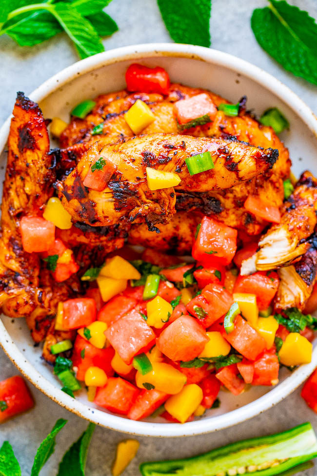 Overhead shot of Grilled Chicken With Watermelon Mango Mint Salsa in a white bowl