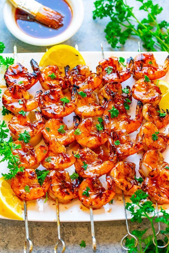 Overhead shot of 10-Minute Honey Barbecue Grilled Shrimp on a white platter