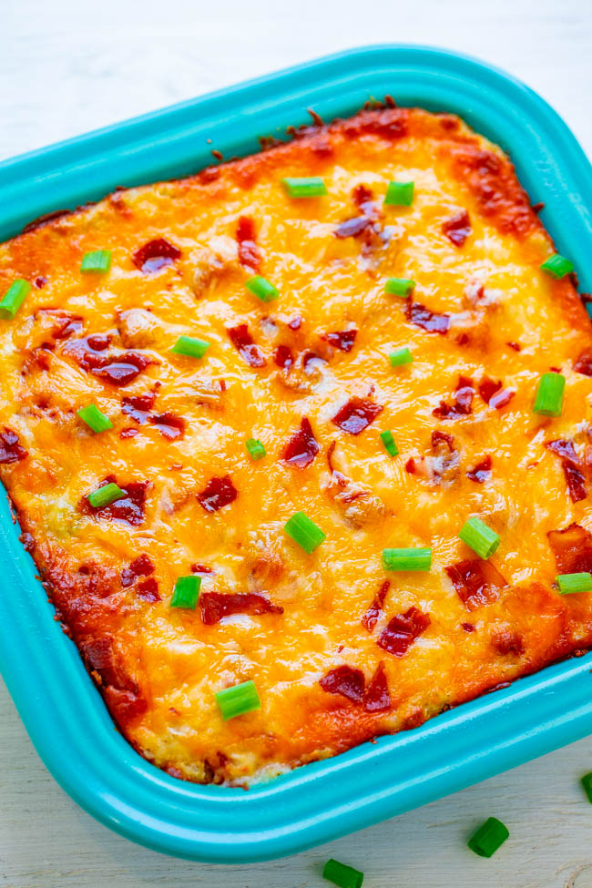 Loaded Twice Baked Potato Casserole - Tender potatoes mixed with butter, cheese, sour cream, bacon, and green onions for the ultimate in LOADED baked potatoes!! AMAZING comfort food that's irresistible!!