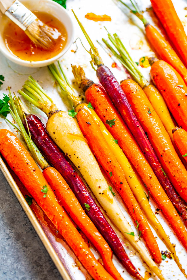 Orange and Honey Roasted Carrots — A fast, EASY, and holiday-friendly side dish everyone will love!! The honey orange glaze adds such great FLAVOR and really jazzes up roasted carrots!!