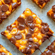 Chocolate chip and caramel nut bars on a baking sheet.