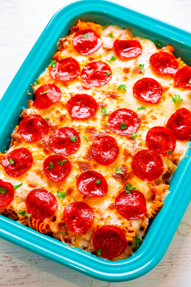 Pepperoni Pizza Casserole — EASY, ready in 20 minutes, and for times when you want BOTH pizza AND pasta!! Ground beef, pepperoni, and oodles of cheese make this pizza casserole pure COMFORT FOOD! Feeds a crowd!!