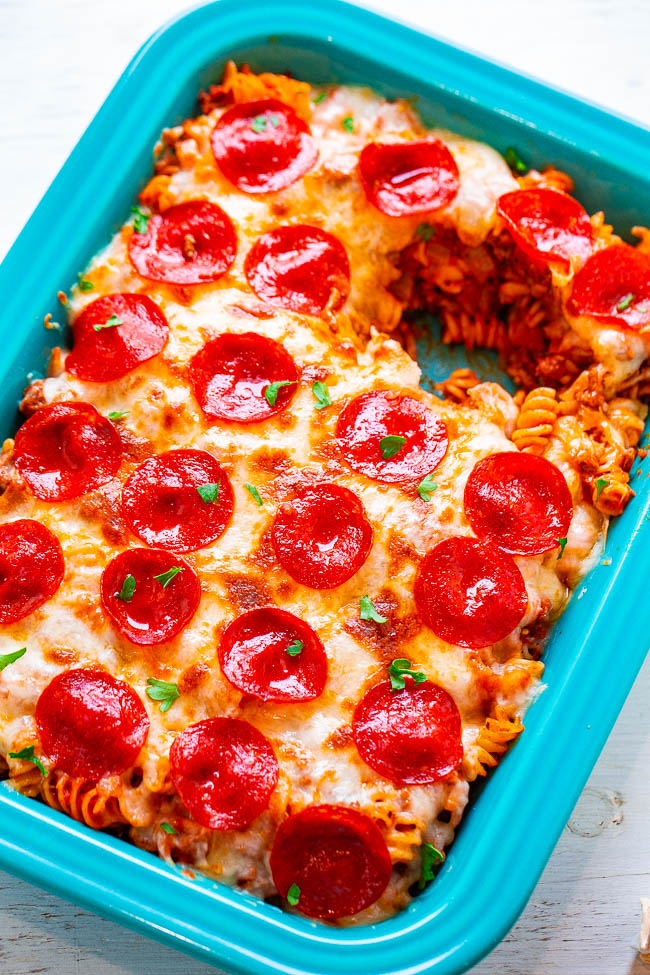Pepperoni Pizza Casserole — EASY, ready in 20 minutes, and for times when you want BOTH pizza AND pasta!! Ground beef, pepperoni, and oodles of cheese make this pizza casserole pure COMFORT FOOD! Feeds a crowd!!