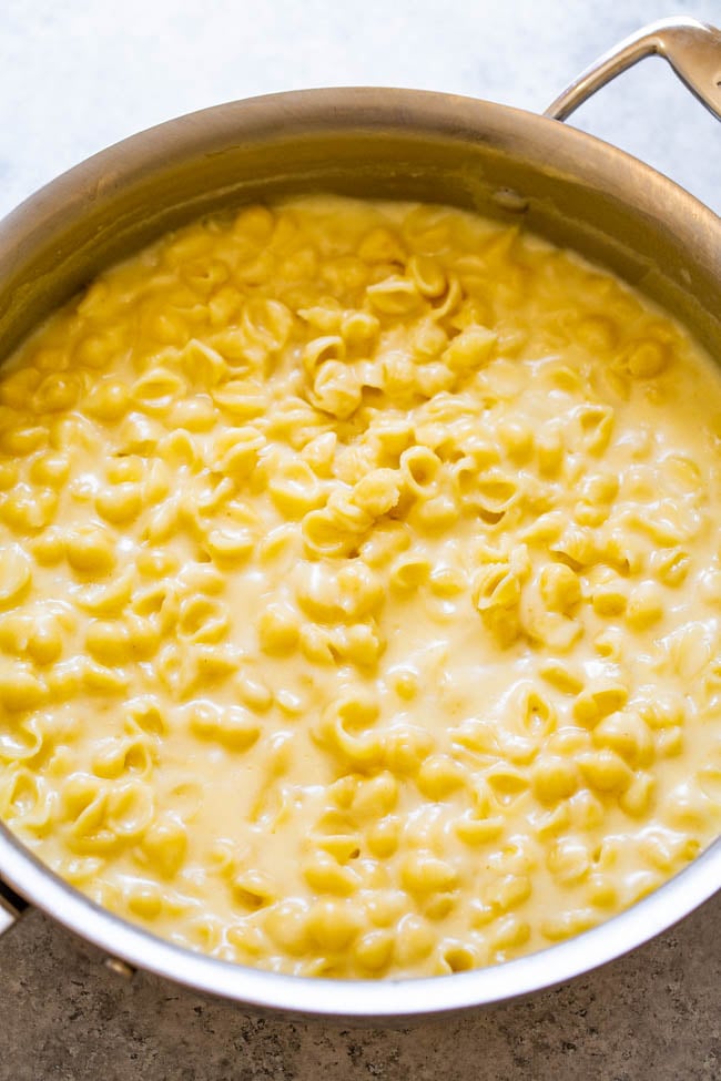 20-Minute Stovetop White Cheddar Mac and Cheese - Almost as FAST and EASY as using a box but tastes a million times BETTER!! So creamy, ridiculously cheesy, and the extra sharp white cheddar cheese gives this mac and cheese so much FLAVOR!!