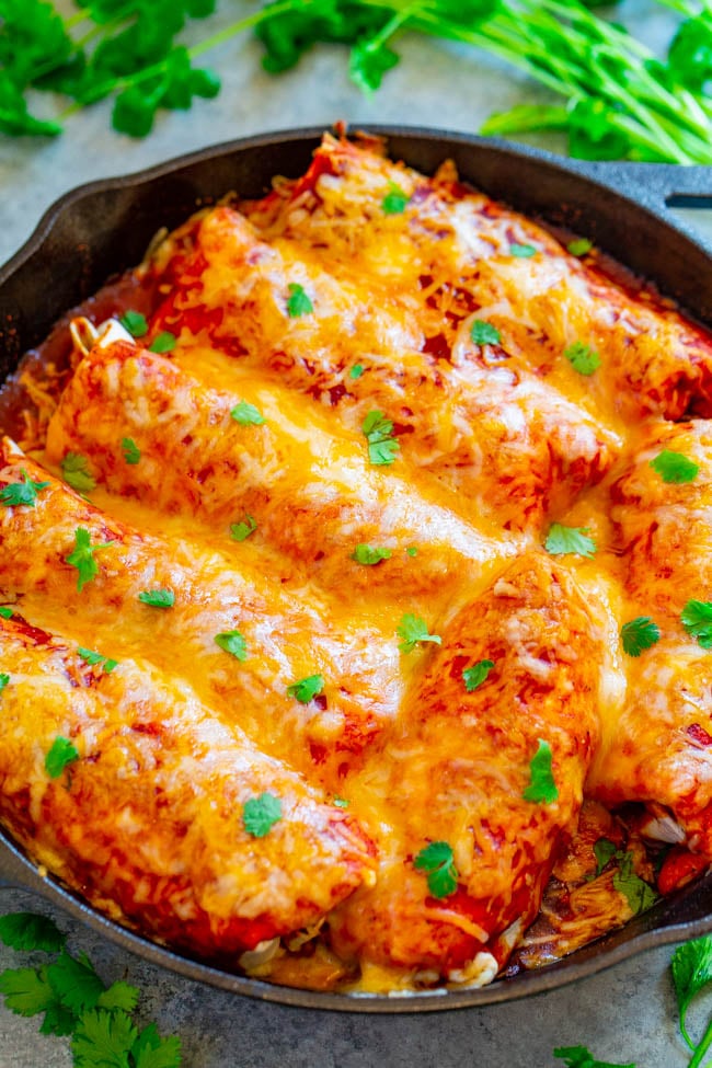 Loaded Smothered Beef Burritos — Mexican comfort food that's loaded with seasoned ground beef, refried beans, rice, and smothered with sauce and CHEESE!! Tastes BETTER than from a restaurant, plus these burritos are freezer-friendly and so EASY!!