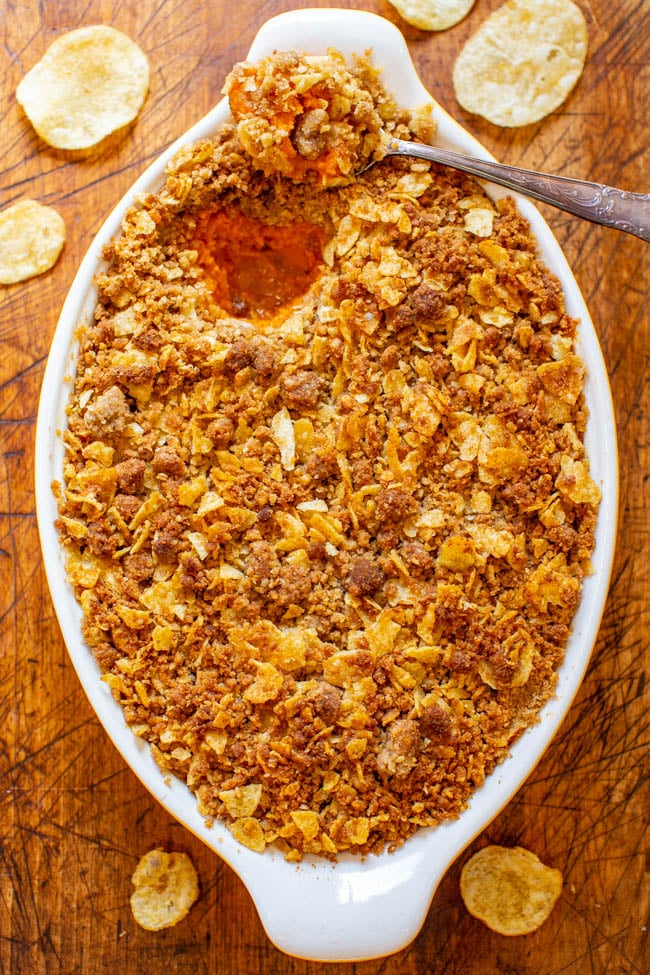 Sweet Potato Casserole With Potato Chip Topping - A fun and EASY twist on classic sweet potato casserole that uses potato chips in the topping for a SALTY-SWEET flavor the whole family will love!! Great for Thanksgiving and Christmas celebrations!!