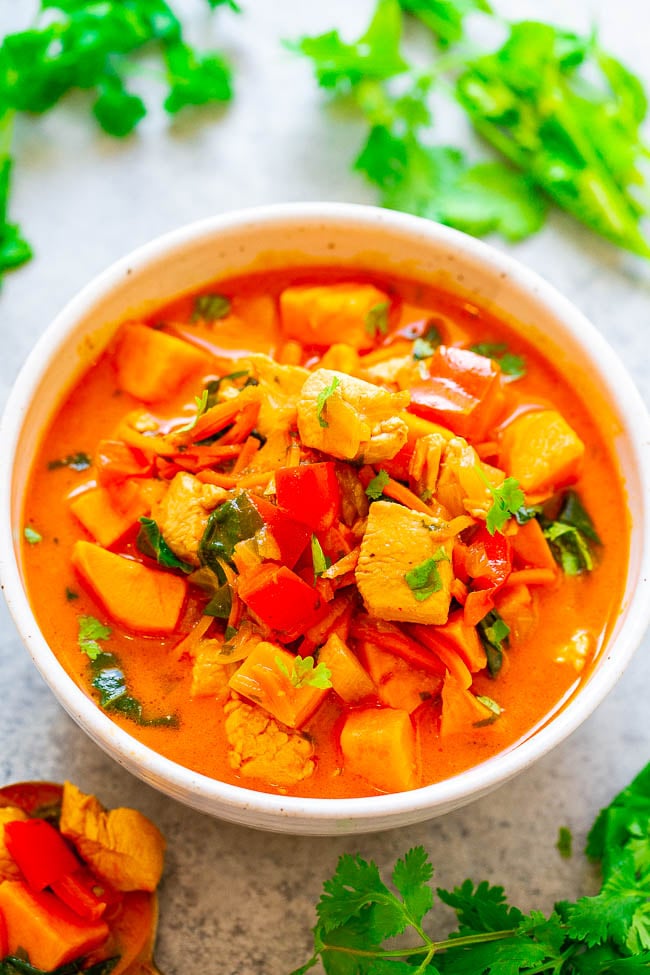 Thai Chicken Coconut Curry Soup — EASY, ready in 30 minutes, HEALTHY, and loaded with FLAVOR!! The sweet potatoes, carrots, red peppers, chicken, spinach, cilantro, and coconut milk broth combine to form an AMAZING soup!!