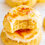 Stack of glazed biscuits with a bitten piece showing the fluffy interior.
