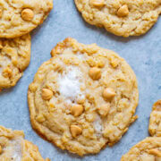 Butterscotch chip cookies on parchment paper.