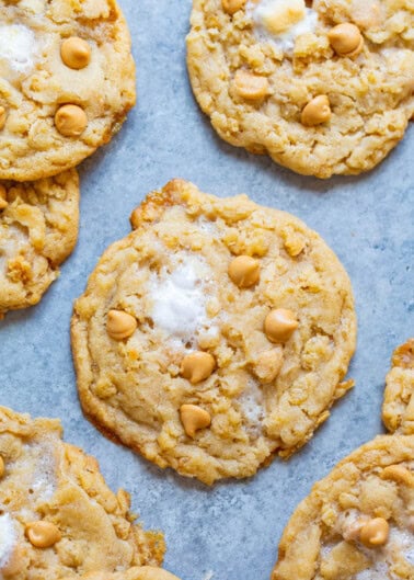 Butterscotch chip cookies on parchment paper.
