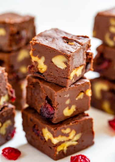 Stack of chocolate brownies with walnuts and cranberries.