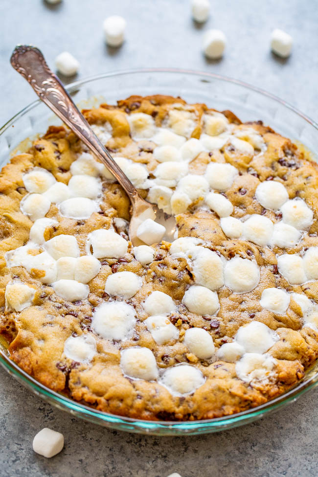 Gooey Chocolate Chip and Marshmallow Cookie Pie - The whole pie tastes like the soft, GOOEY, underbaked centers of fresh chocolate chip cookies!! Between the melted chocolate, marshmallows, and big time gooey factor, this pie is PERFECT!!