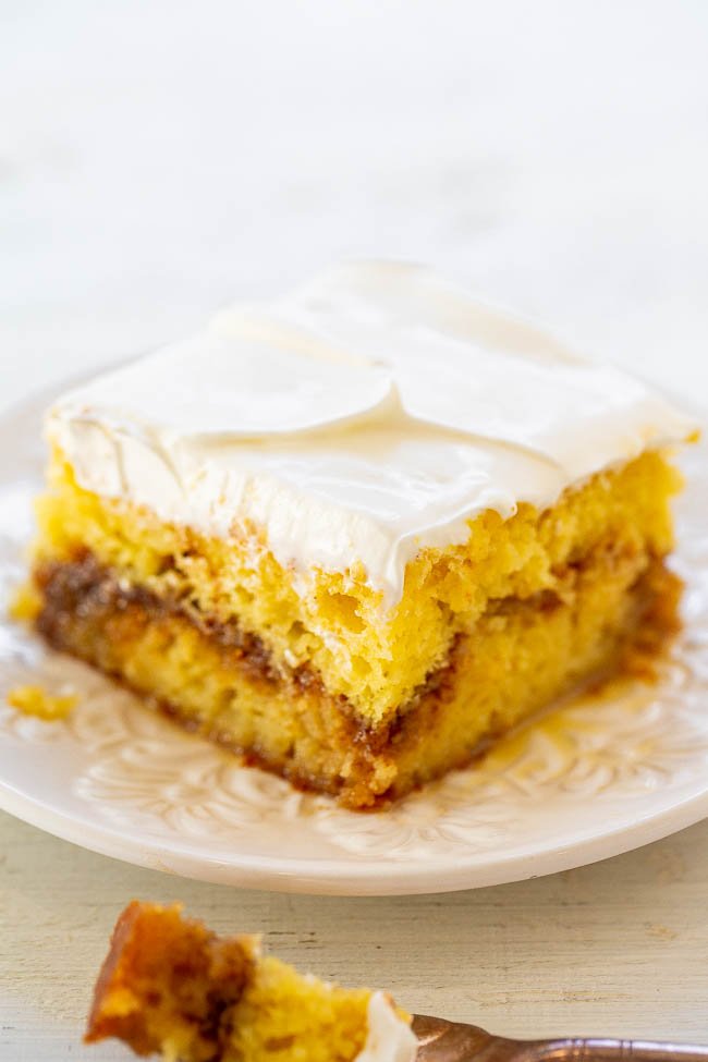 Honey Bun Poke Cake - Tastes like a Honey Bun in cake form!! Sweet, rich, decadent, and reminds me of the Honey Buns I used to eat as a kid! Fast and EASY!!