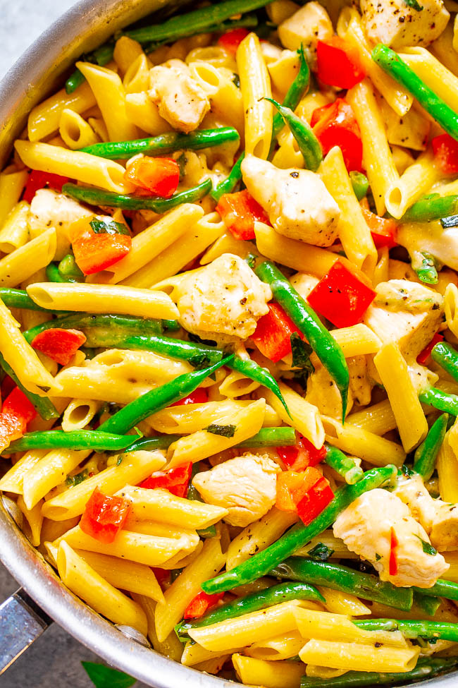 Asiago Chicken Pasta — EASY comfort food to feed a crowd that's ready in 25 minutes!! Tender chicken and penne pasta with red peppers, green beans, and everything is coated with Asiago CHEESE for the family dinner win!!