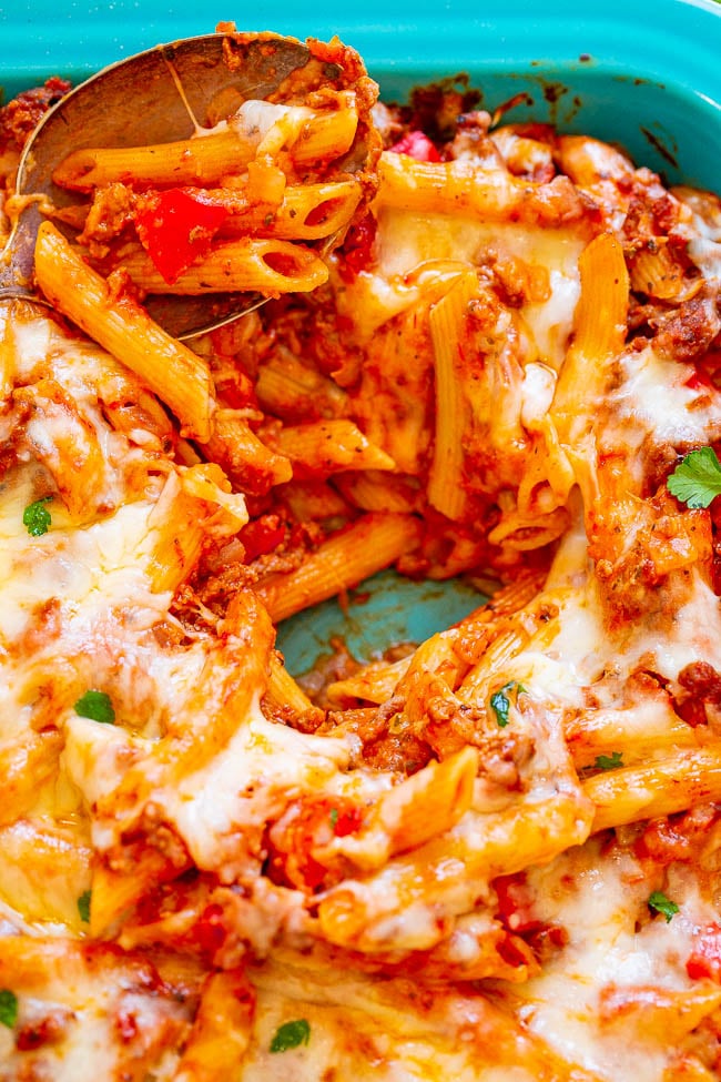 Cheesy Beef and Pasta Casserole - Hearty comfort food that's EASY and IRRESISTIBLE!! Cheesy pasta and beef coated in marinara sauce and topped with more CHEESE! Makes planned leftovers and is freezer-friendly!!