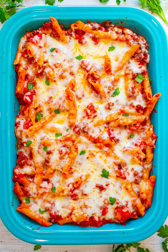 Cheesy Beef and Pasta Casserole - Hearty comfort food that's EASY and IRRESISTIBLE!! Cheesy pasta and beef coated in marinara sauce and topped with more CHEESE! Makes planned leftovers and is freezer-friendly!!