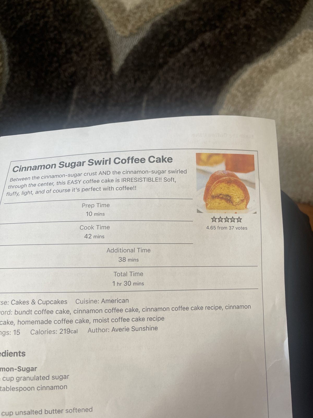 A printed recipe page for cinnamon sugar swirl coffee cake, showing prep and cook times, a small cake photo, a star rating, and some nutritional information.