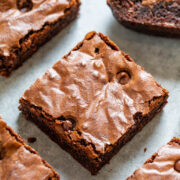 Chocolate chip brownies on parchment paper.