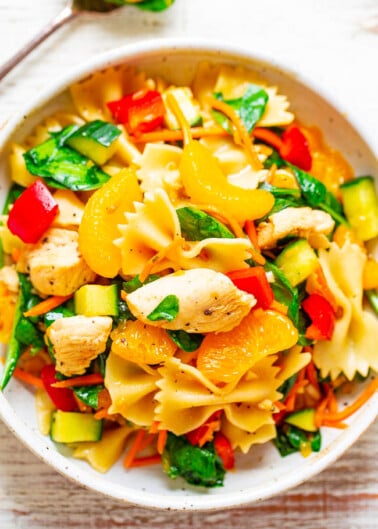 A bowl of pasta salad with chicken and mixed vegetables.