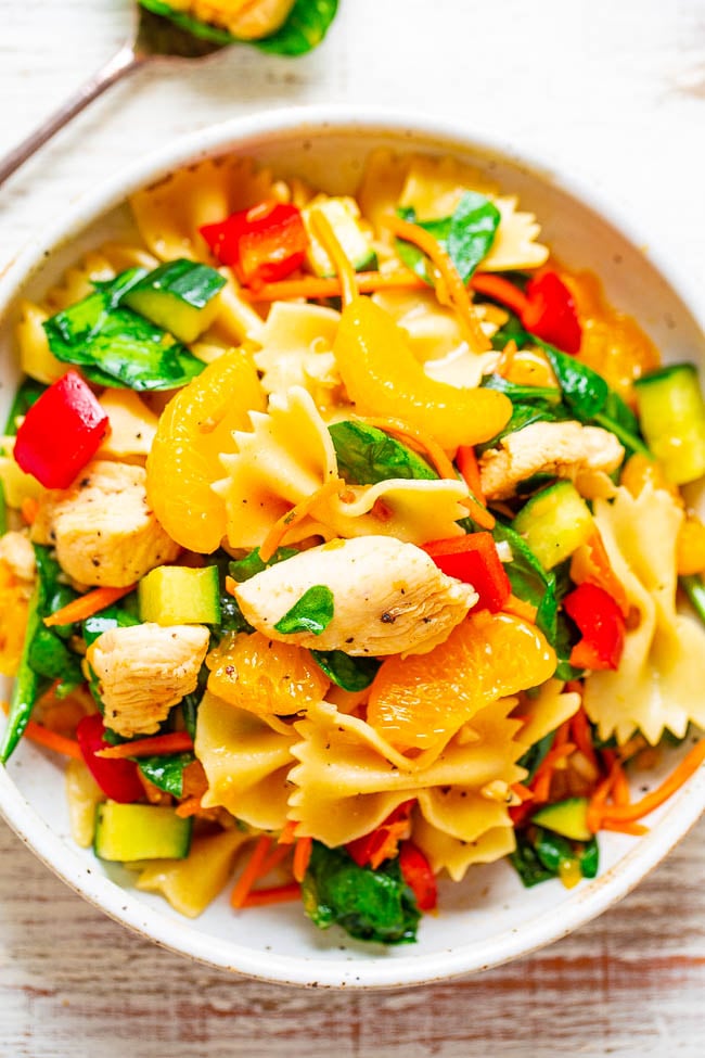 Mandarin Chicken Pasta Salad — EASY, ready in 30 minutes, and packed with Asian-inspired flavors!! Juicy sesame chicken, pasta, and lots of healthy vegetables! PERFECT for potlucks, picnics, parties, and planned leftovers!!