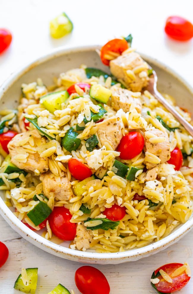 Greek Lemon Chicken and Orzo - EASY, ready in 25 minutes, and feeds a crowd!! Juicy lemon chicken with orzo, fresh spinach, cucumbers, and tomatoes make this a dinnertime WINNER! Great for parties, picnics, and potlucks!!