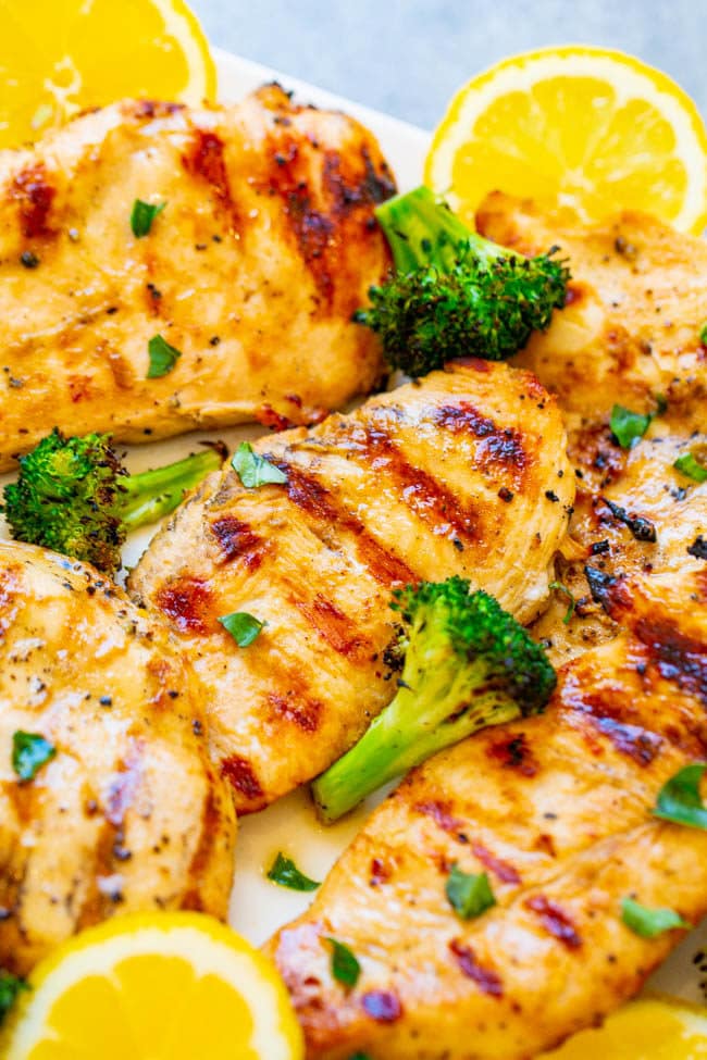 Grilled Lemon Chicken with broccoli on a white plate 