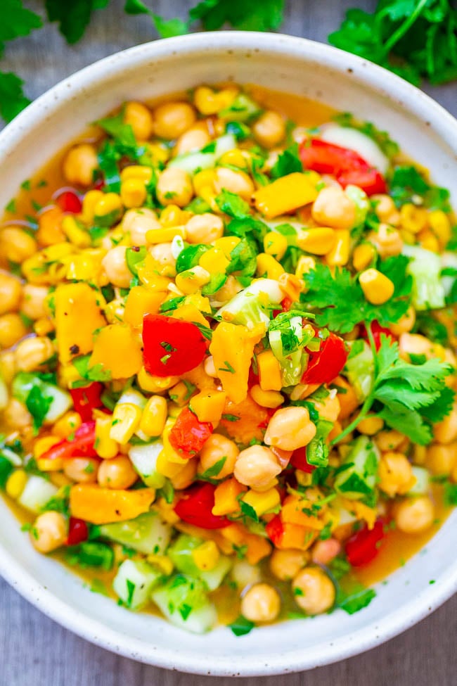 Mango Chickpea Corn Salad — An EASY salad that's ready in 5 minutes, HEALTHY, and full of Mexican-inspired flavors!! Great as a meatless lunch, dinner side dish, or for picnics and potlucks!!