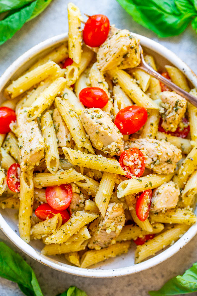 Pesto Parmesan Chicken and Pasta - EASY, ready in 20 minutes, and every piece of tender chicken and pasta is coated in fresh pesto sauce and parmesan cheese!! Great for easy weeknight dinners, planned leftovers, or for parties because it feeds a crowd!!