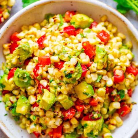 Grilled Corn and Avocado Salad - An EASY and HEALTHY salad that's ready in 10 minutes and you won't be able to stop eating it!! Juicy corn, creamy avocado, cilantro, and fresh lime juice is a FIESTA in your mouth!!
