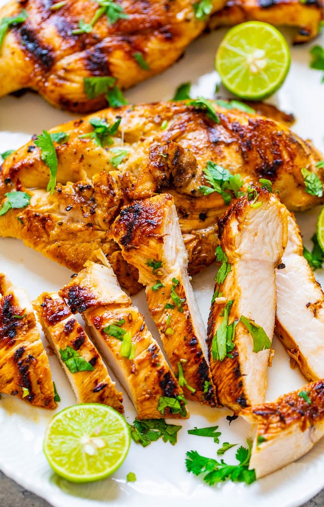 Grilled Lime Cilantro Chicken - EASY, ready in 10 minutes, and the chicken is so TENDER, juicy, and full of Mexican-inspired flavor!! Put this HEALTHY chicken recipe on your summer menu rotation and it'll be a hit with everyone!!